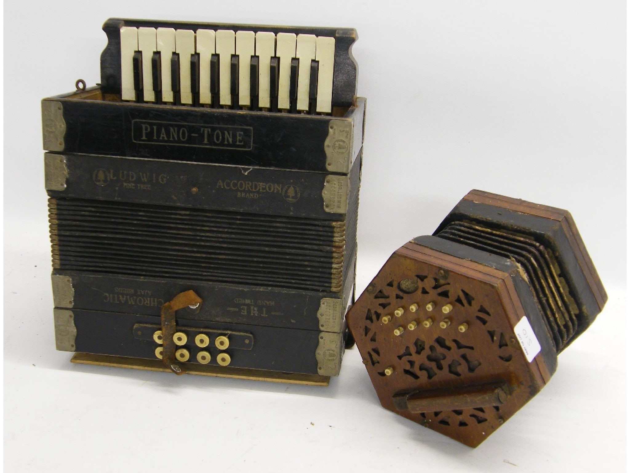 Appraisal: Ludwig piano-tone two row melodeon at fault together with a