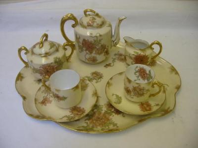 Appraisal: A LIMOGES PORCELAIN TETE A TETE brown printed and painted