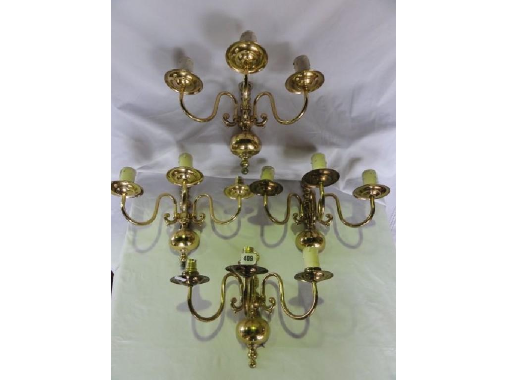 Appraisal: Four traditional brass wall lights each with three branches