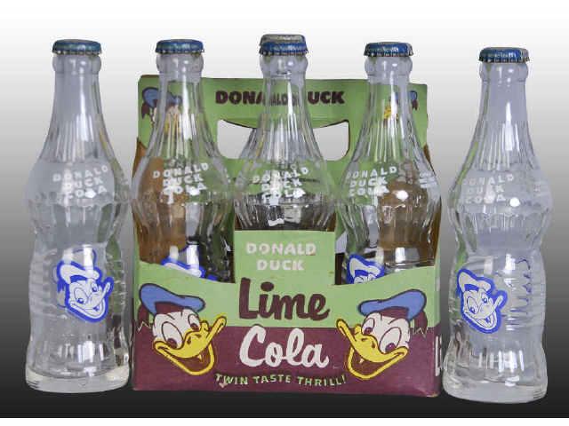 Appraisal: Donald Duck Cola -Pack Carrier w Bottles Description s to