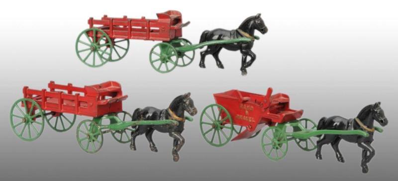 Appraisal: Lot of Cast Iron Kenton Horse-Drawn Toys Description Includes sand