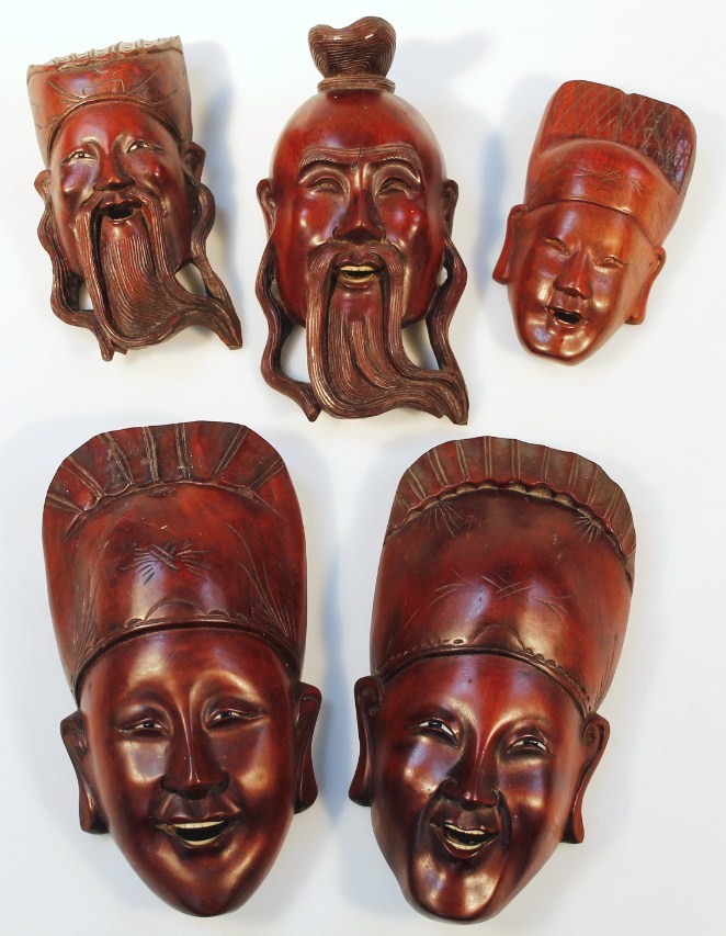 Appraisal: A quantity of Tibetan and other hardwood face masks to