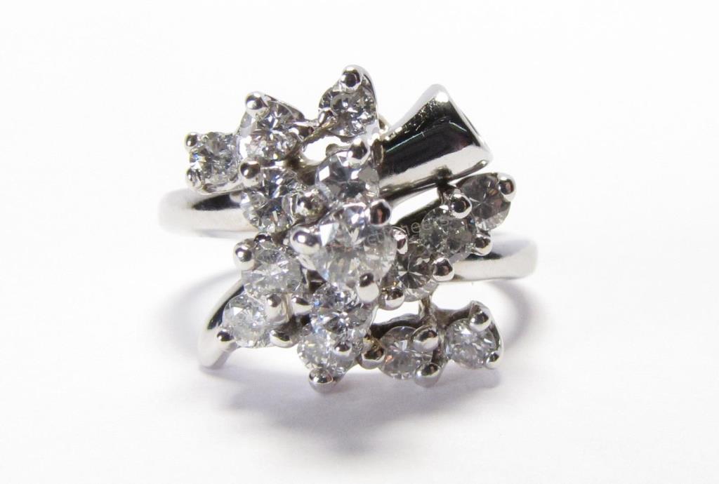 Appraisal: An antique K white gold cluster ring with fifteen round