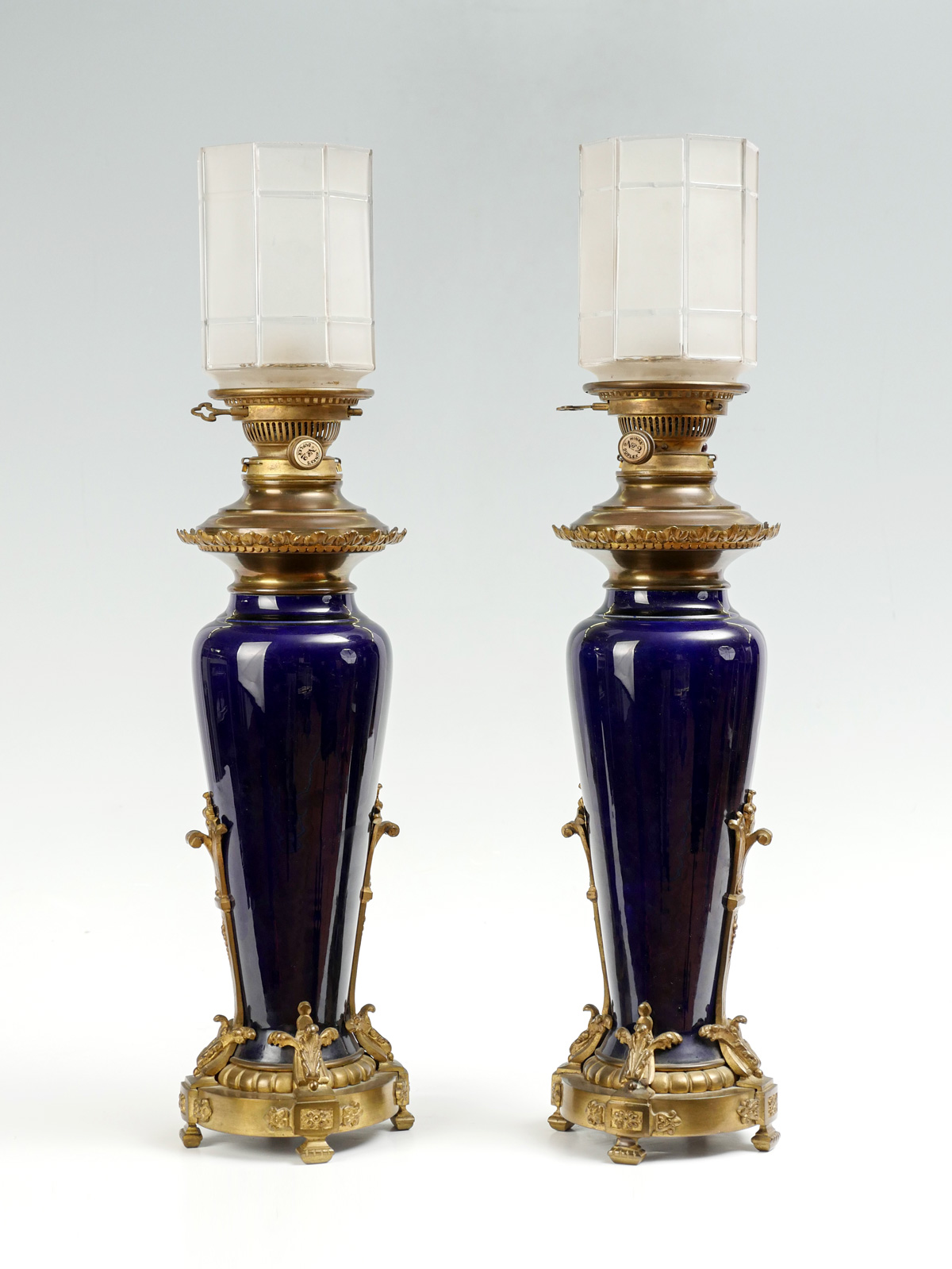 Appraisal: PAIR OF BLUE PORCELAIN METAL MOUNTED LAMPS Ormolu mounted Hink's