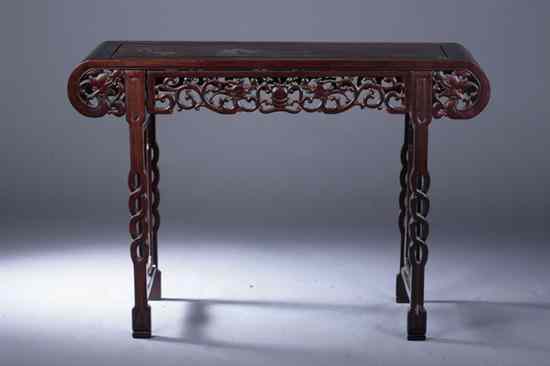 Appraisal: CHINESE ROSEWOOD ALTER TABLE The scroll-form top above openwork apron