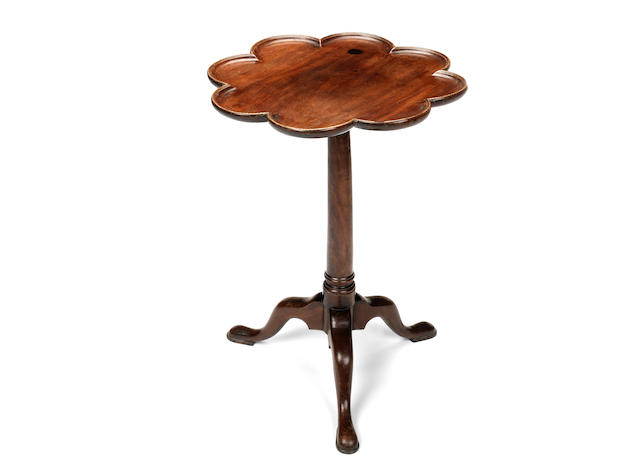 Appraisal: A George III mahogany tripod supper table the eared tilt-top