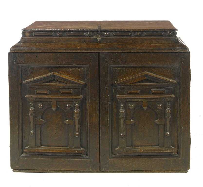 Appraisal: A CHARLES II OAK CABINET in Laudian style the lidded