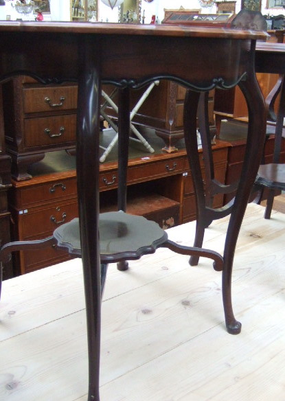 Appraisal: A late th century mahogany circular shaped two tier occasional