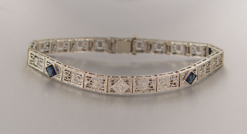 Appraisal: K ART DECO FILIGREE DIAMOND AND SAPPHIRE BRACELET K white