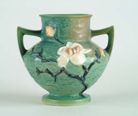 Appraisal: ROSEVILLE MAGNOLIA HANDLED VASE Shape No Roseville mark in relief