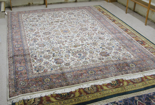 Appraisal: SIGNED INDO-PERSIAN CARPET overall floral design on ivory ground '