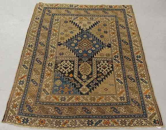 Appraisal: Shirvan oriental prayer carpet in blues and browns with geometric