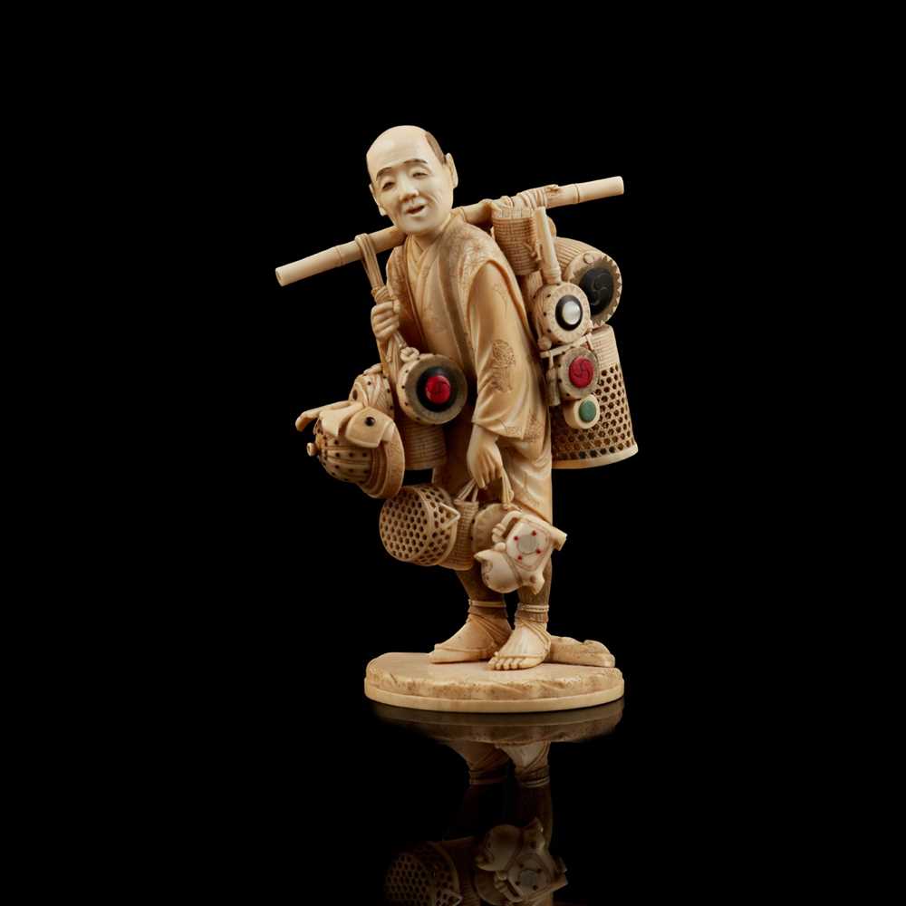 Appraisal: Y IVORY OKIMONO FIGURE OF A STREET VENDOR MEIJI PERIOD