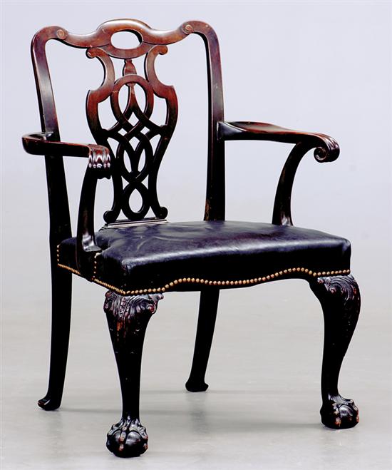 Appraisal: Chippendale style carved mahogany armchair yoked crest and latticework splat