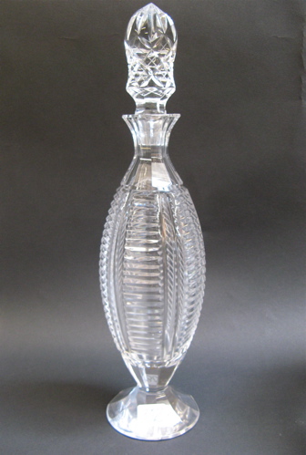 Appraisal: AN AMERICAN CUT CRYSTAL WINE DECANTER having notched panels on