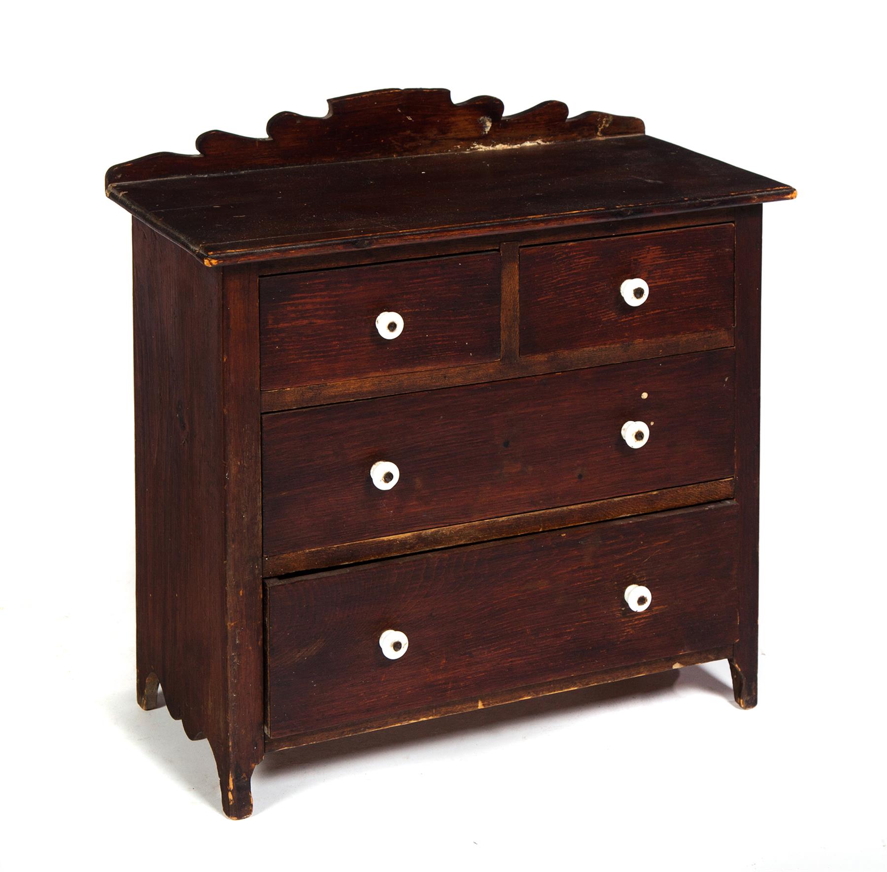 Appraisal: MINIATURE VICTORIAN CHEST American nd half- th century pine Brown-red