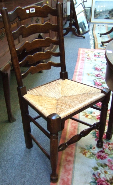 Appraisal: A set of six th century ladder back dining chairs