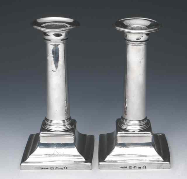 Appraisal: A PAIR OF GEORGE III SILVER CANDLESTICKS on square stepped