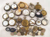 Appraisal: A tin containing mixed watch parts cases and movements