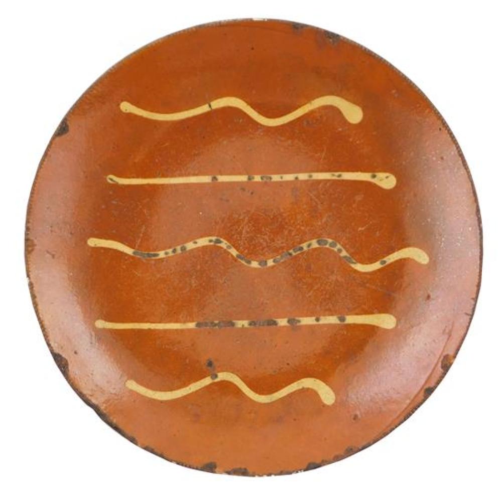 Appraisal: Redware charger th C yellow slip decoration coggled edges wear