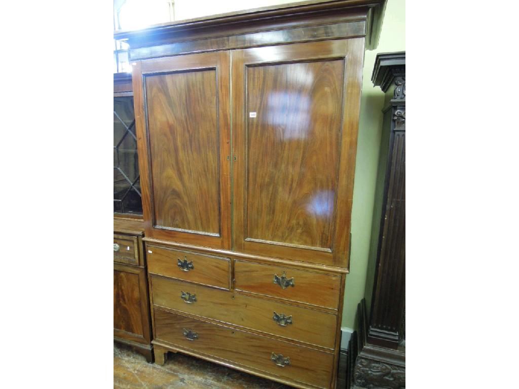 Appraisal: A th century mahogany linen press enclosed by a pair