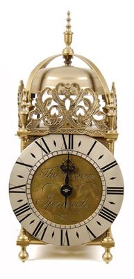 Appraisal: A reproduction brass lantern clock with bird cage movement and