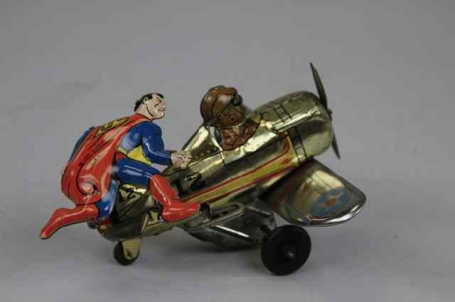 Appraisal: SUPERMAN ROLLOVER AIRPLANE Marx Toys lithographed tin great toy design