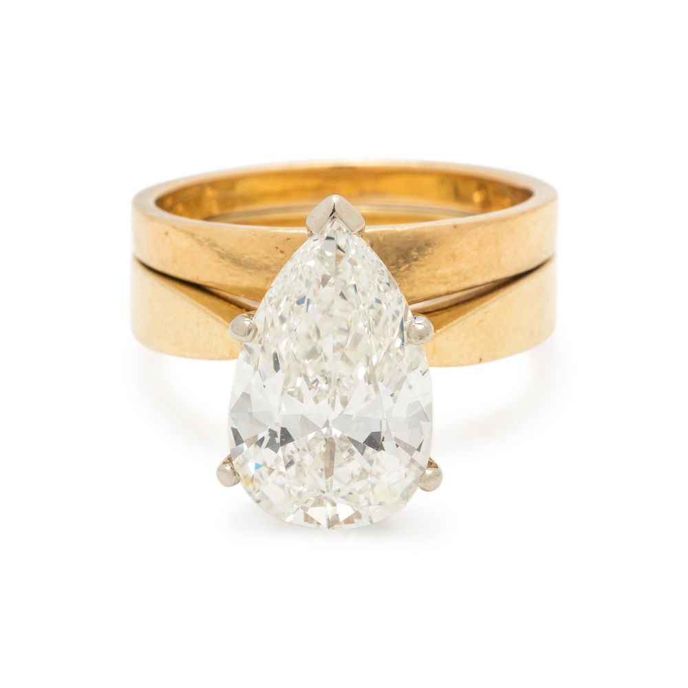 Appraisal: DIAMOND RING SET DIAMOND RING SET Containing one pear brilliant