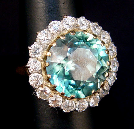 Appraisal: CT ZIRCON RING CIRCLED BY DIAMONDS K yellow gold ring