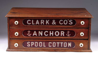 Appraisal: CLARK S ANCHOR BRAND SPOOL CABINET A three-drawer walnut cabinet