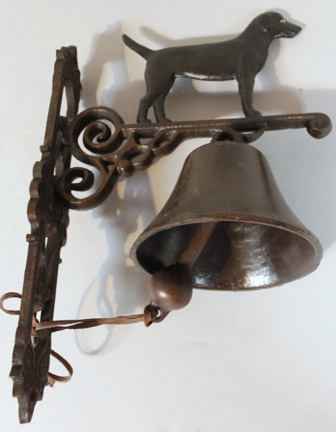 Appraisal: A modern house bell surmounted by dog with shaped fixing