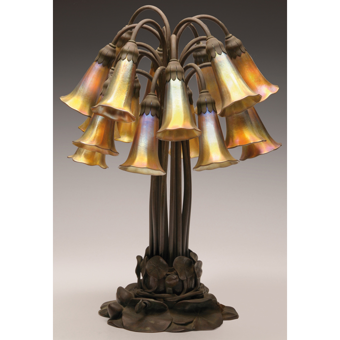 Appraisal: Tiffany Studios lamp eighteen-light lily sculpted bronze base holding favrile