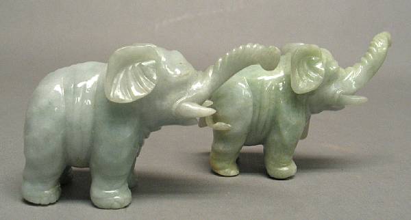 Appraisal: A pair of small carved jadeite elephants Each with up-raised