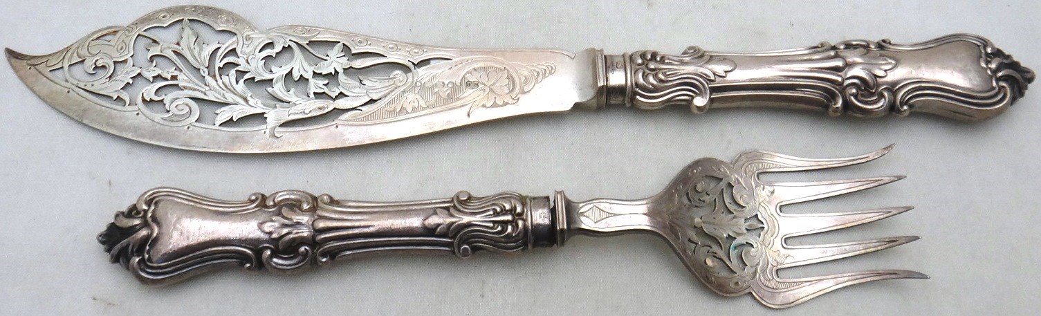 Appraisal: A pair of Victorian silver fish servers each with pierced