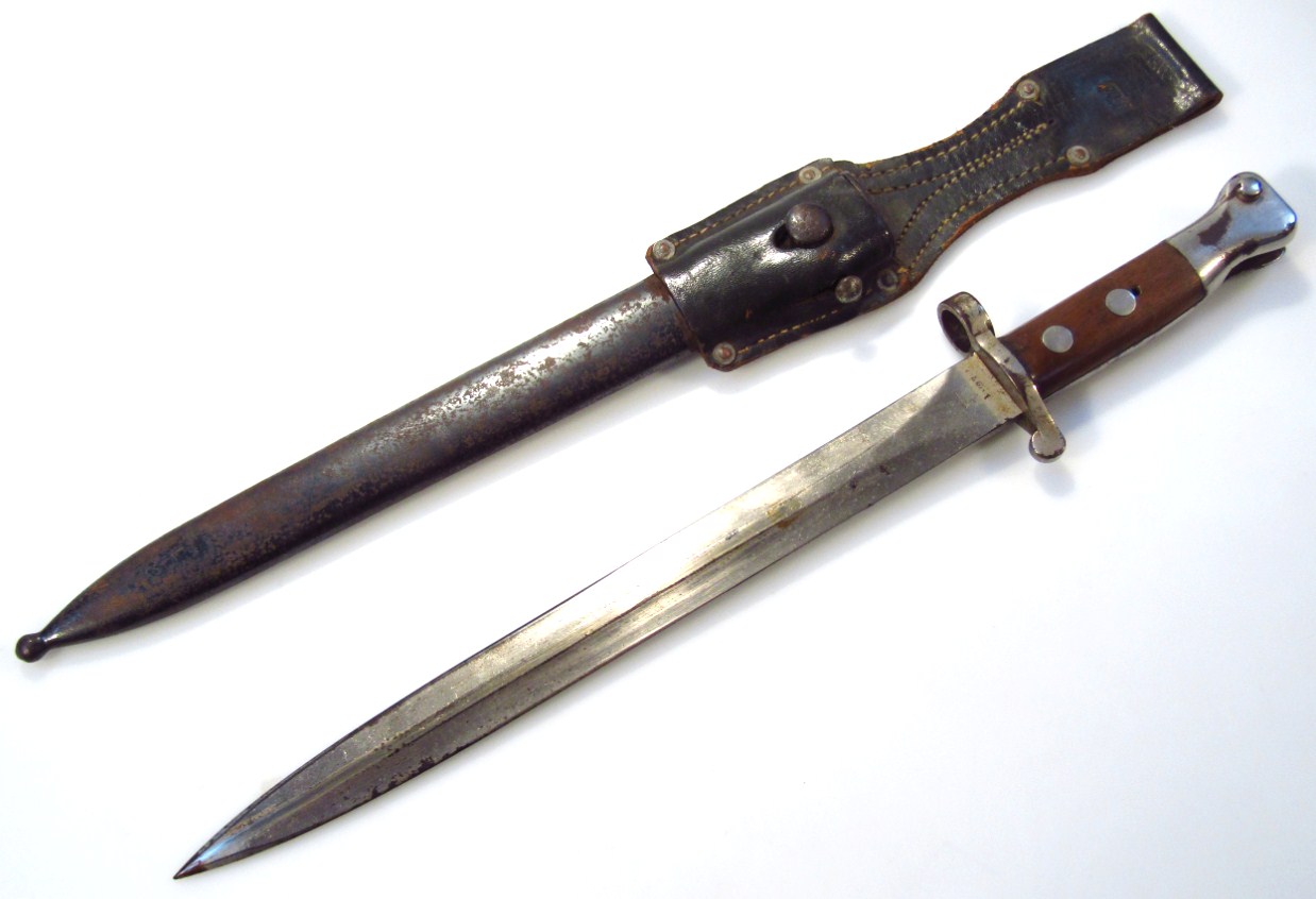 Appraisal: A VP L bayonet and scabbard with shaped blade metal