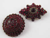 Appraisal: Two Bohemian garnet brooches one approx cm long the other