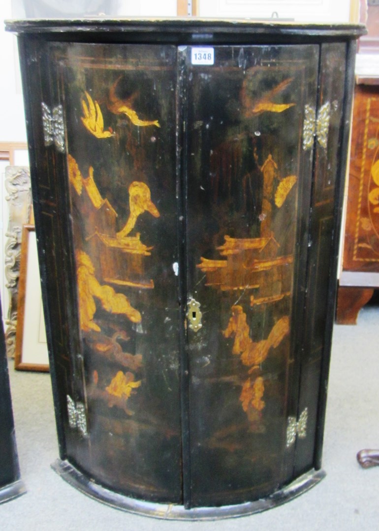 Appraisal: An th century black lacquer chinoiserie decorated bowfront hanging two