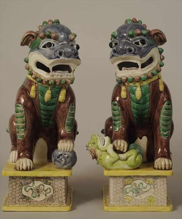 Appraisal: PAIR OF CHINESE FAMILLE VERTE PORCELAIN FU DOG FIGURES in