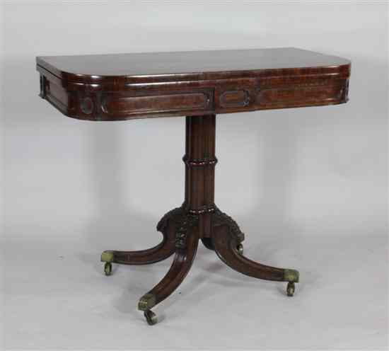 Appraisal: A William IV carved mahogany card table with cluster column