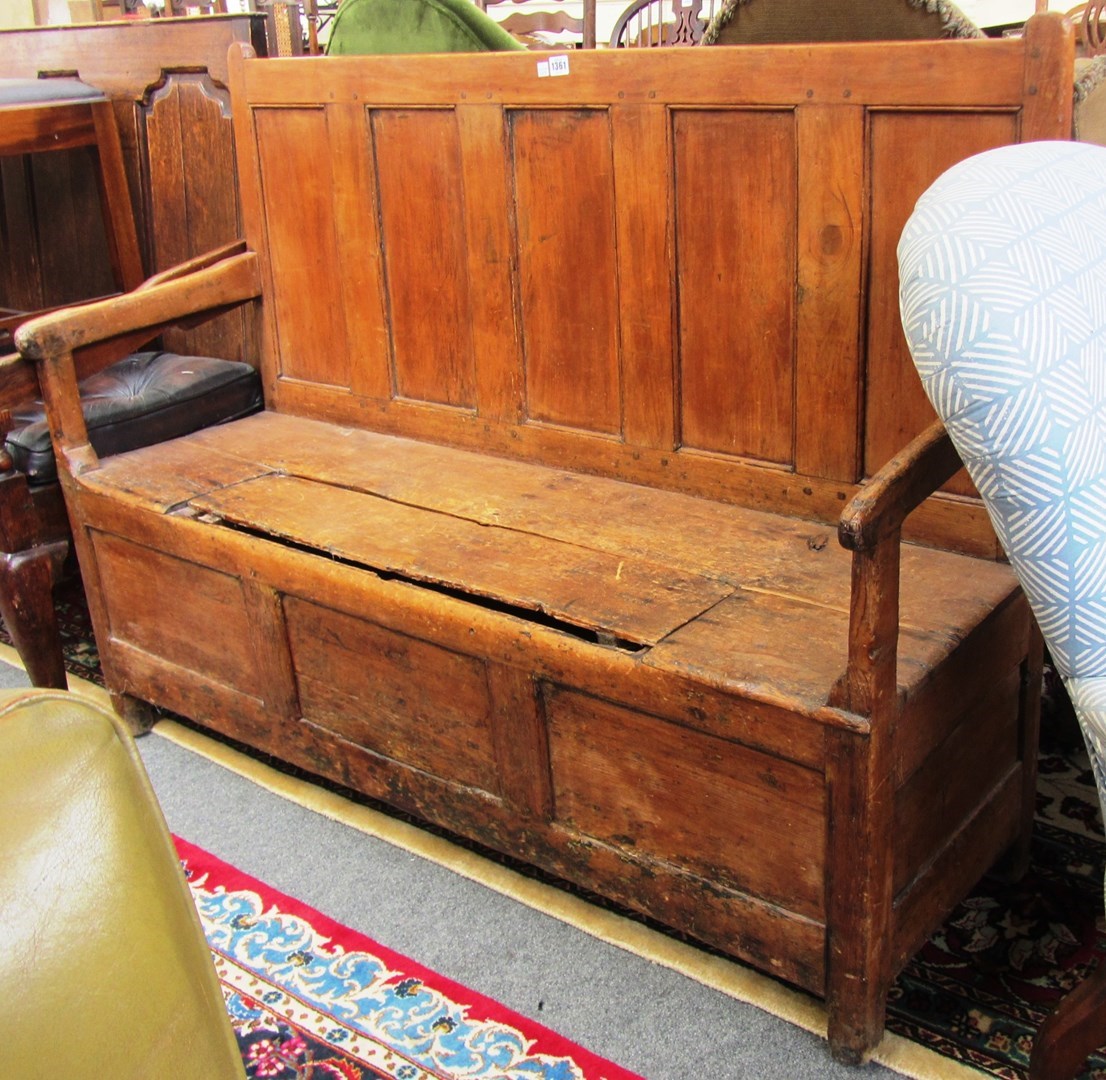 Appraisal: An oak th century pine panel beech open arm settle