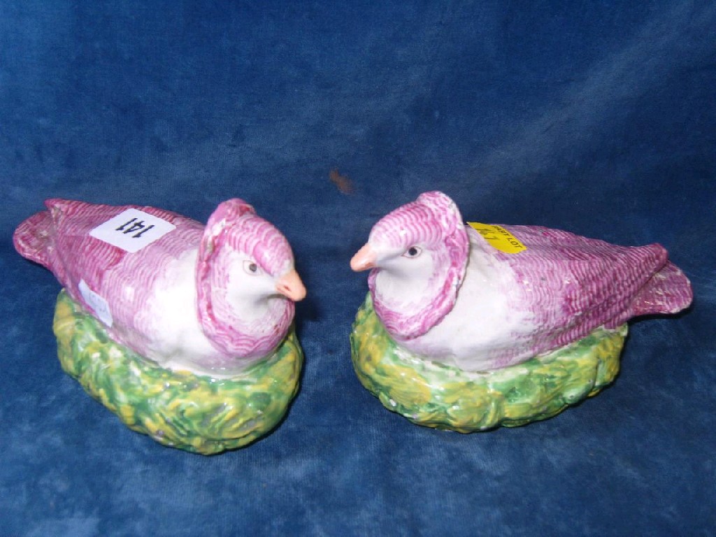 Appraisal: A pair of th century Staffordshire models of pigeons with