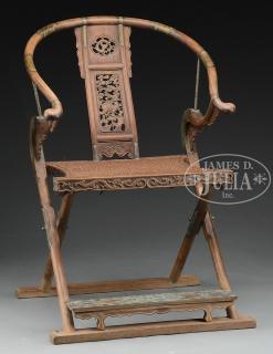 Appraisal: CARVED HORSESHOE BACK FOLDING ARM CHAIR th century China The