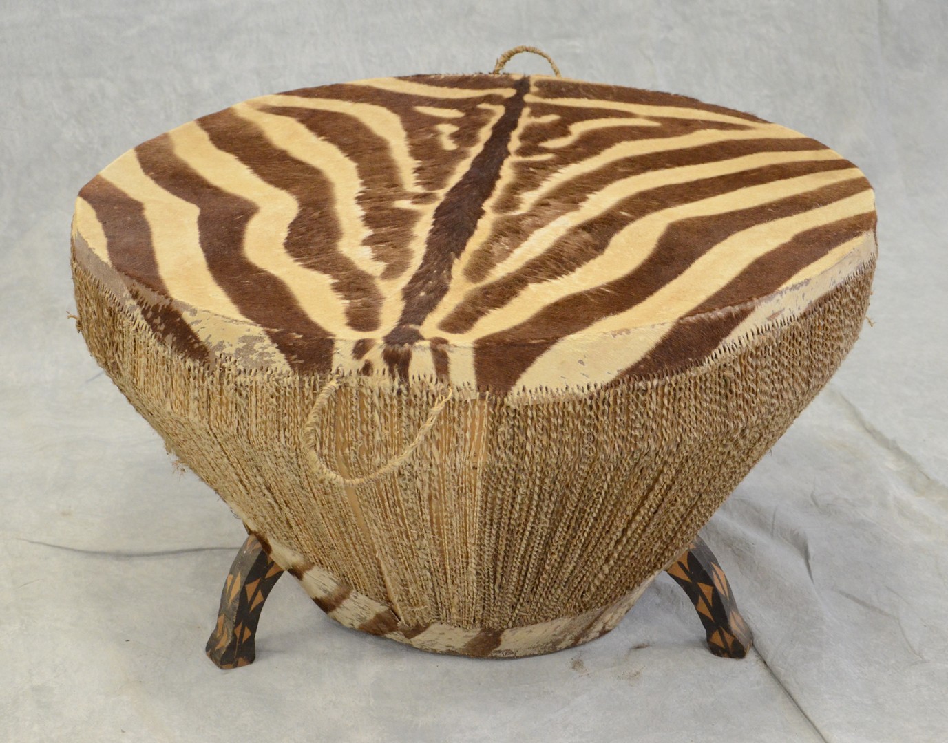 Appraisal: African Zebra skin kettle drum with natural cording and painted