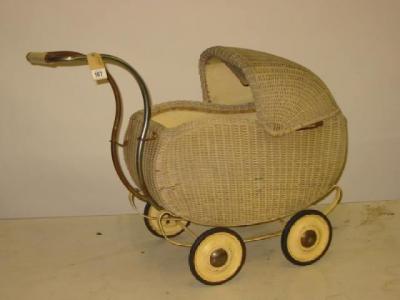 Appraisal: An early th century dolls pram woven wicker construction including