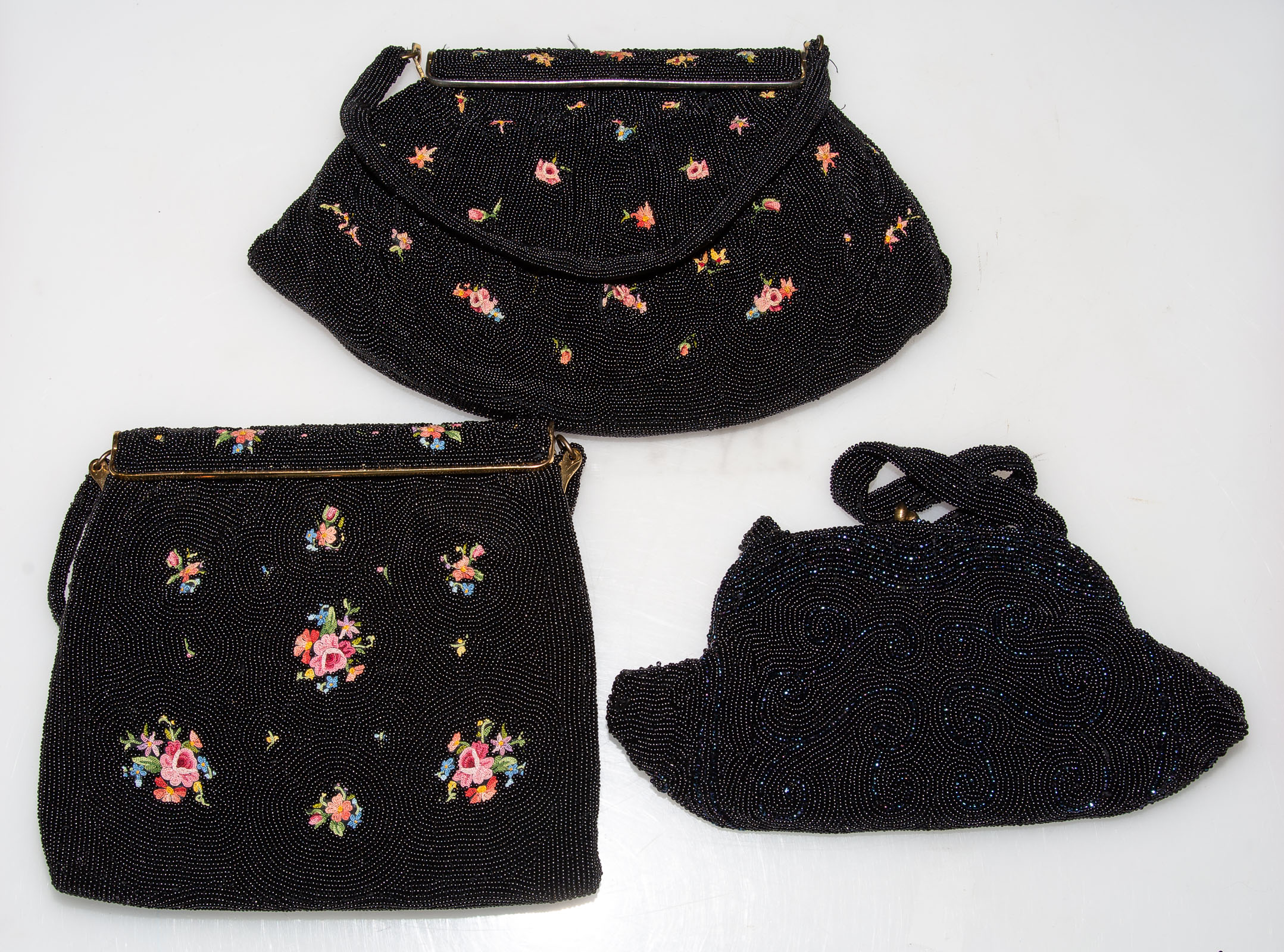 Appraisal: THREE VINTAGE BEADED HANDBAGS including two with embroidered flowers -