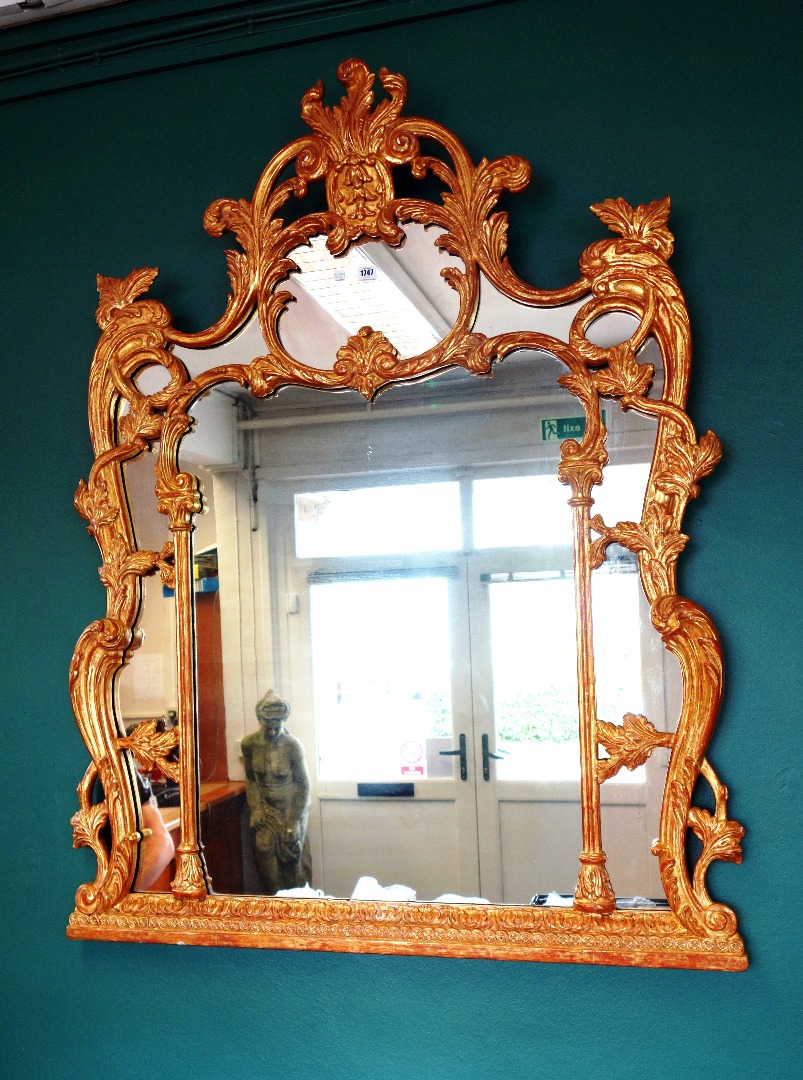 Appraisal: An th century style gilt framed overmantel mirror with segmented