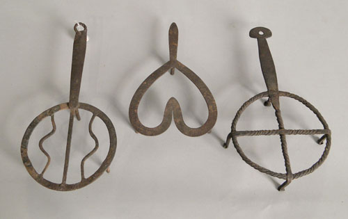 Appraisal: Three wrought iron trivets th c largest - dia