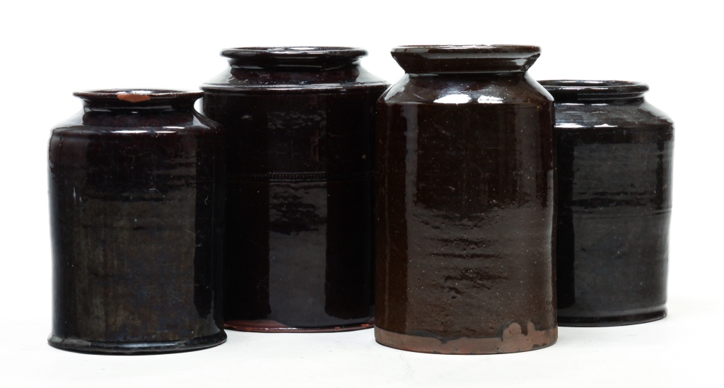 Appraisal: FOUR AMERICAN REDWARE CANNING JARS Mid th century All with