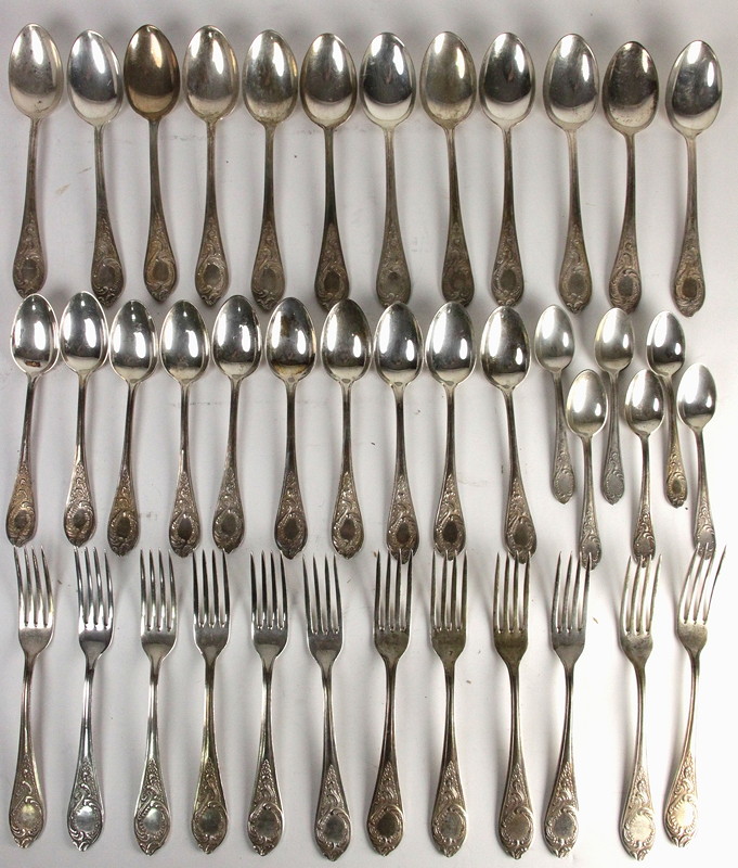 Appraisal: A canteen of Russian white metal flatware with scroll framed