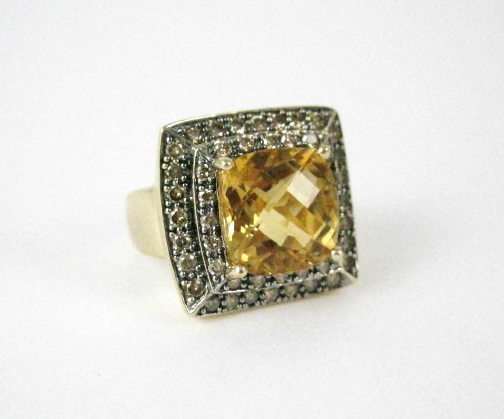 Appraisal: CITRINE DIAMOND AND FOURTEEN KARAT GOLD RING with round-cut champagne